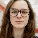 Close-up portrait of woman wearing eyeglasses